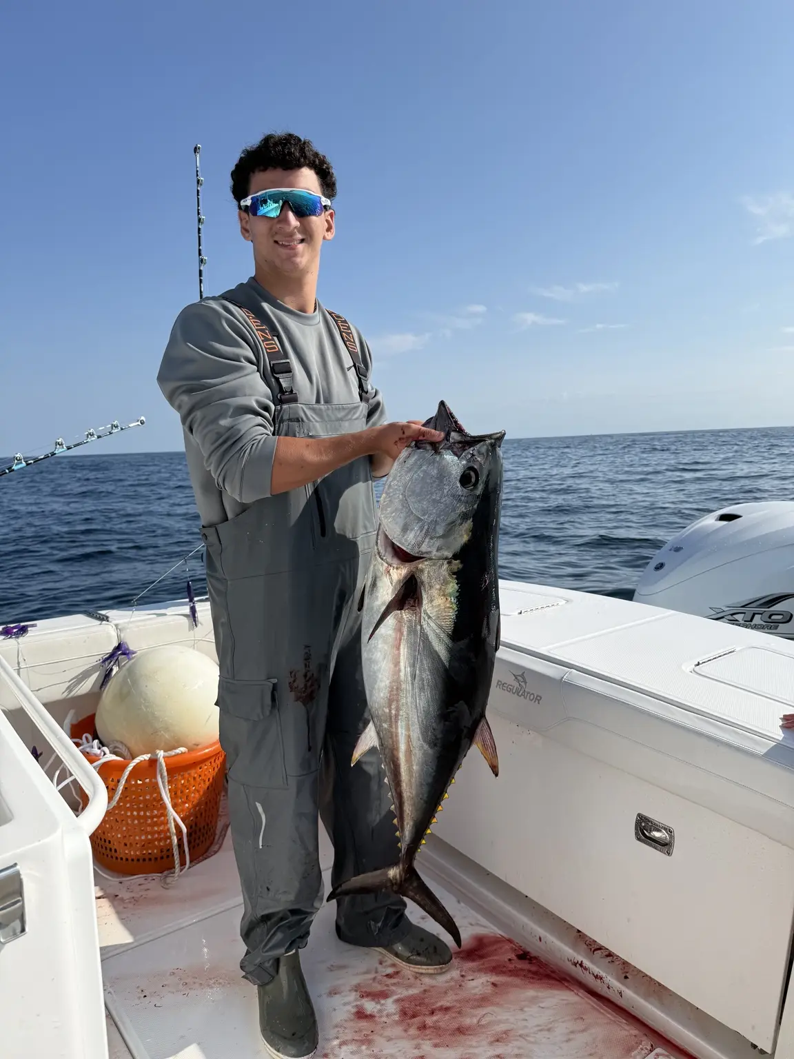 Angler holding a bluefin tuna during an offshore trip